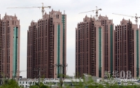新华社照片，上海，2011年12月11日    “限购令”何去何从？——楼市“限购”一年间    这是位于上海西南角的几幢即将完工的住宅楼（10月26日摄）。       新华社记者 凡军 摄  