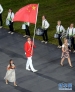 7月27日，第三十届夏季奥林匹克运动会在英国伦敦开幕。图为中国代表团旗手易建联（前中）在开幕式上入场。 新华社记者王毓国摄 