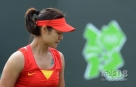 新华社照片，伦敦，2012年7月28日 李娜在比赛中。当日，在伦敦奥运会网球女单第一轮比赛中，中国选手李娜以1比2不敌斯洛伐克选手汉图楚娃。新华社记者陶希夷摄