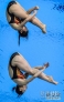 7月29日，吴敏霞/何姿在比赛中。当日，在伦敦奥运会跳水女子双人3米板决赛中，中国选手吴敏霞/何姿以346.20分的成绩夺冠。新华社记者刘大伟摄 