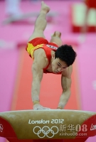 7月30日，中国选手冯喆在跳马比赛中。当日，在伦敦奥运会体操男团决赛中，中国队以275.997分的成绩成功卫冕。新华社记者戚恒摄 