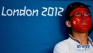 8月8日，一名中国观众在看到中国选手景瑞雪未能获得金牌时露出遗憾的表情。当日，在伦敦奥运会摔跤女子自由式63公斤级决赛中，中国选手景瑞雪不敌日本选手伊调馨，获得亚军。 新华社记者格桑达瓦摄