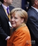 10月18日，在比利时首都布鲁塞尔，德国总理默克尔抵达欧盟总部出席欧盟峰会。为期两天的欧盟秋季首脑会议18日在布鲁塞尔召开。新华社照片，布鲁塞尔，2012年10月18日 新华社记者周磊摄 